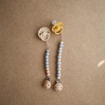Mushie pacifier clip stone